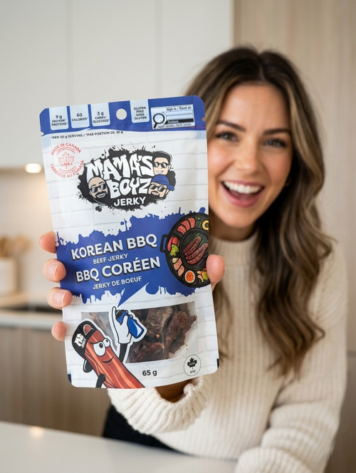 Girl holding a bag of Mama's Boyz Jerky Korean BBQ flavour